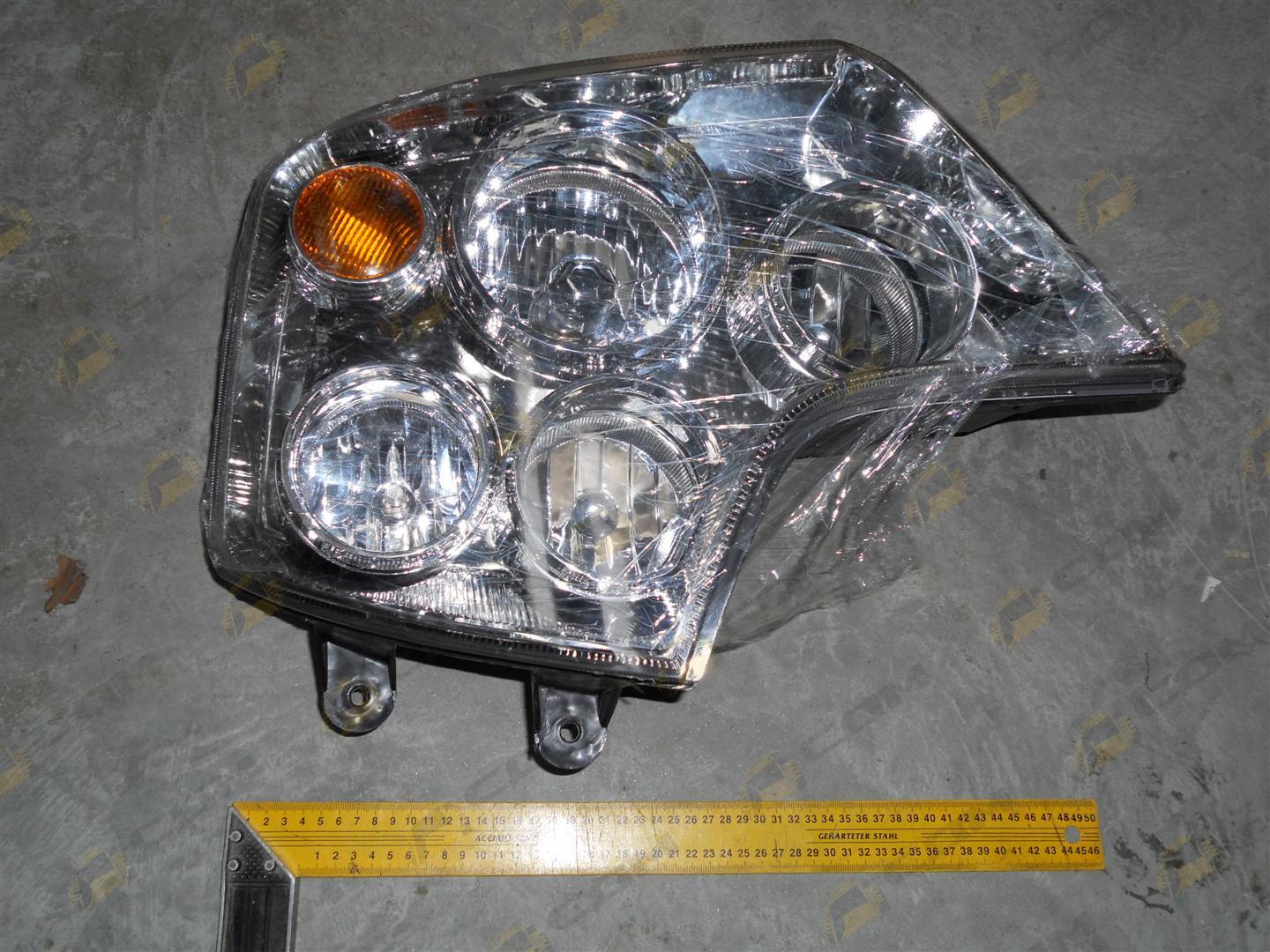 Фара передняя левая HOWO A7 WG9925720001